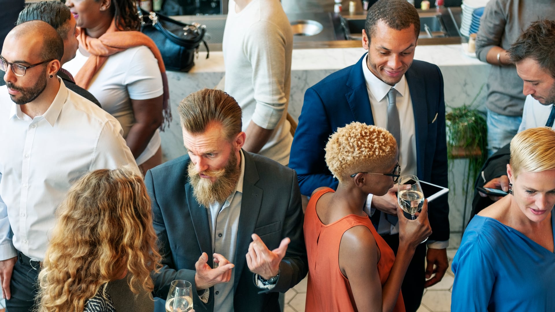 People talking at a company dinner.